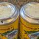 Cerveja Na Bundinha (two inverted beer cans with salt and lime juice served on top)